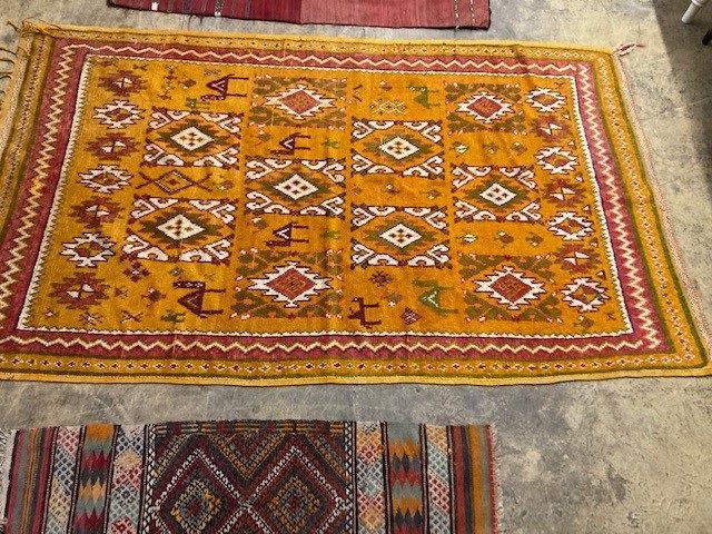 Two Kelim rugs and a geometric wool rug, largest 240 x 140cm